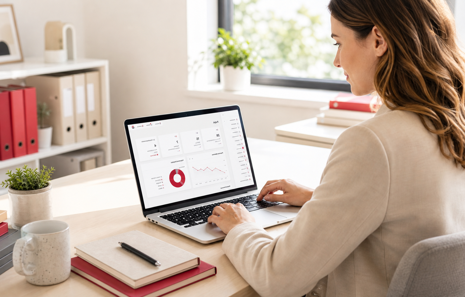 An employee working with the CRM on a laptop